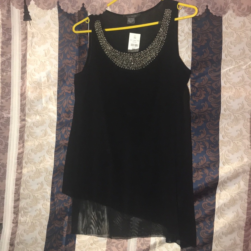 Black sleeveless top with embellished neckline.